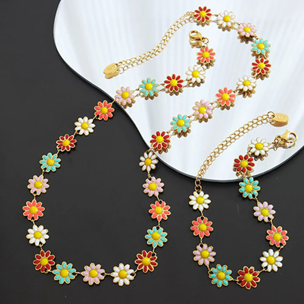 Gold-tone flower necklace with chain and multicolor daisy links