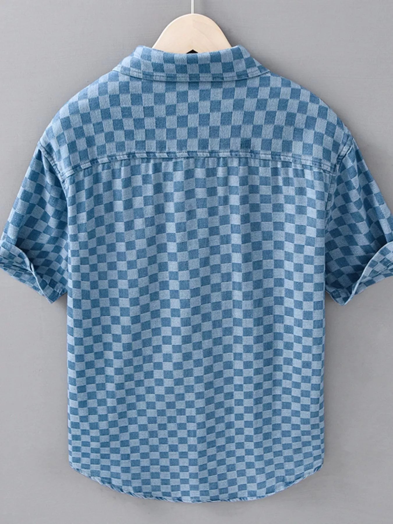 Light blue checkered short-sleeve casual shirt, back view with rounded hem