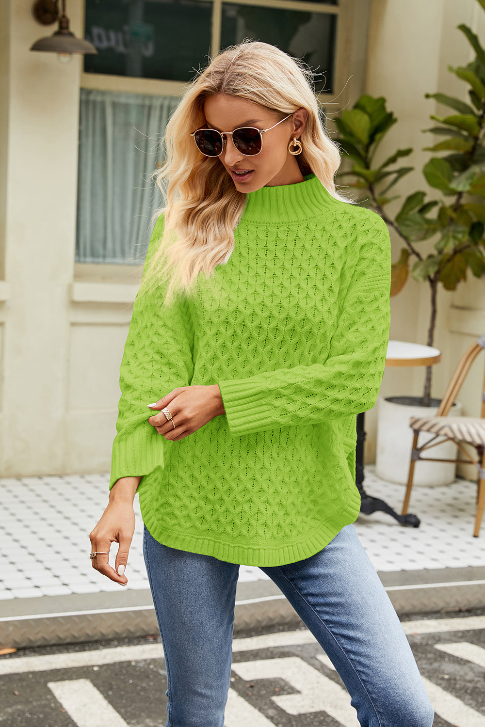 Neon green mock neck long-sleeve sweater with textured diamond knit pattern
