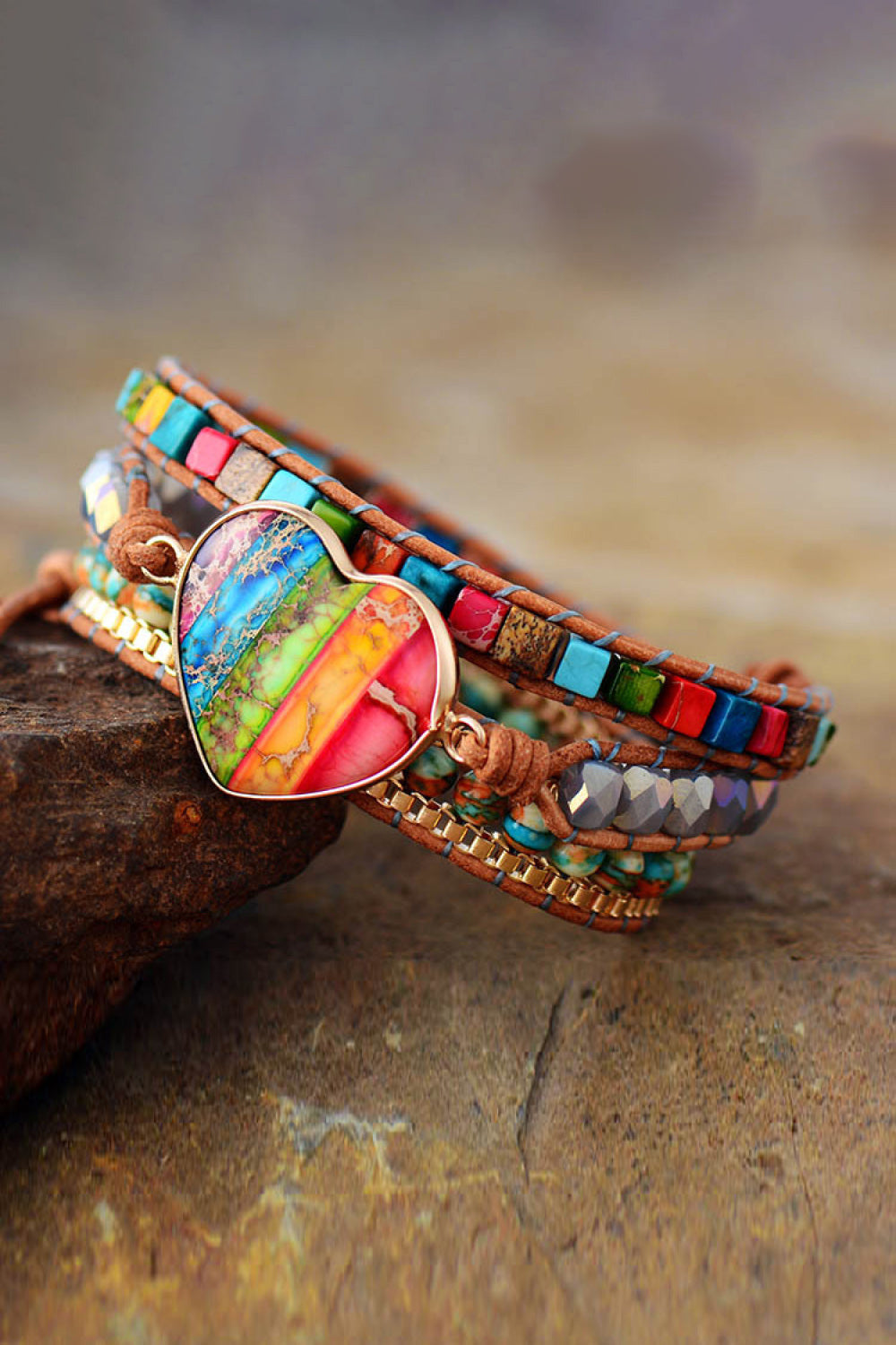 Layered beaded bracelet with large heart crystal pendant and wraparound leather cord