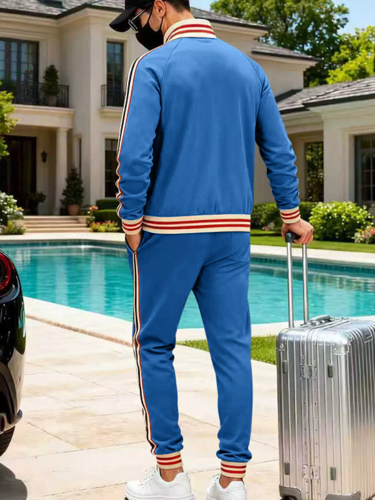 Blue zip-up track jacket and jogger pants set from back view with striped ribbed trim