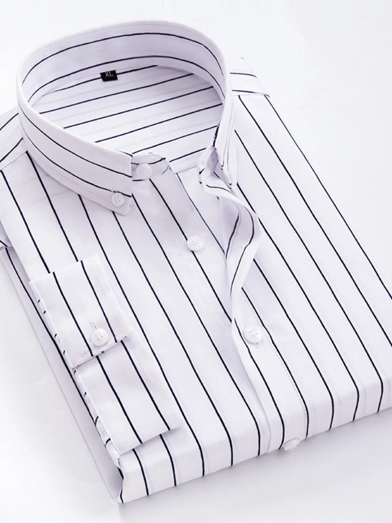 Striped button-up long-sleeve shirt in white with dark stripes, round white buttons