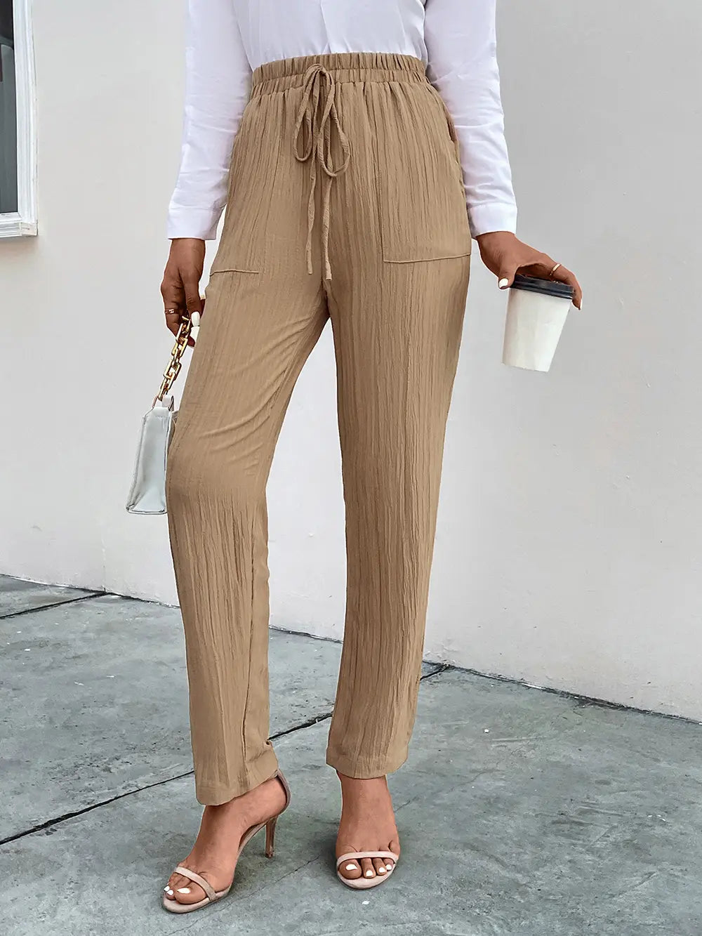 Tan textured drawstring pants with side pockets and relaxed straight-leg cut