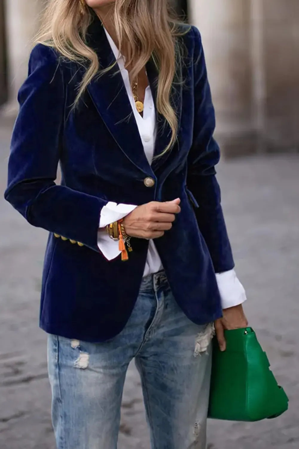 Dark navy one-button lapel blazer with long sleeves and single button at the front.