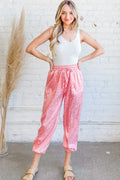Pink satin leopard print joggers with elastic waistband and drawstring
