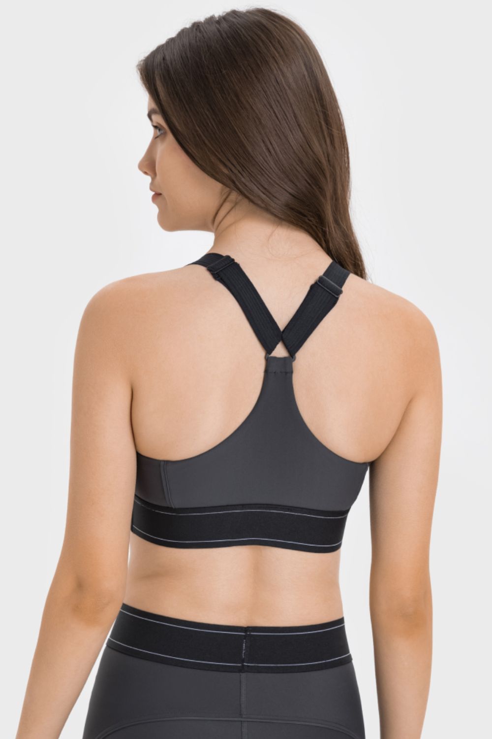 Contrast sports bra back view with crisscross straps and black trim
