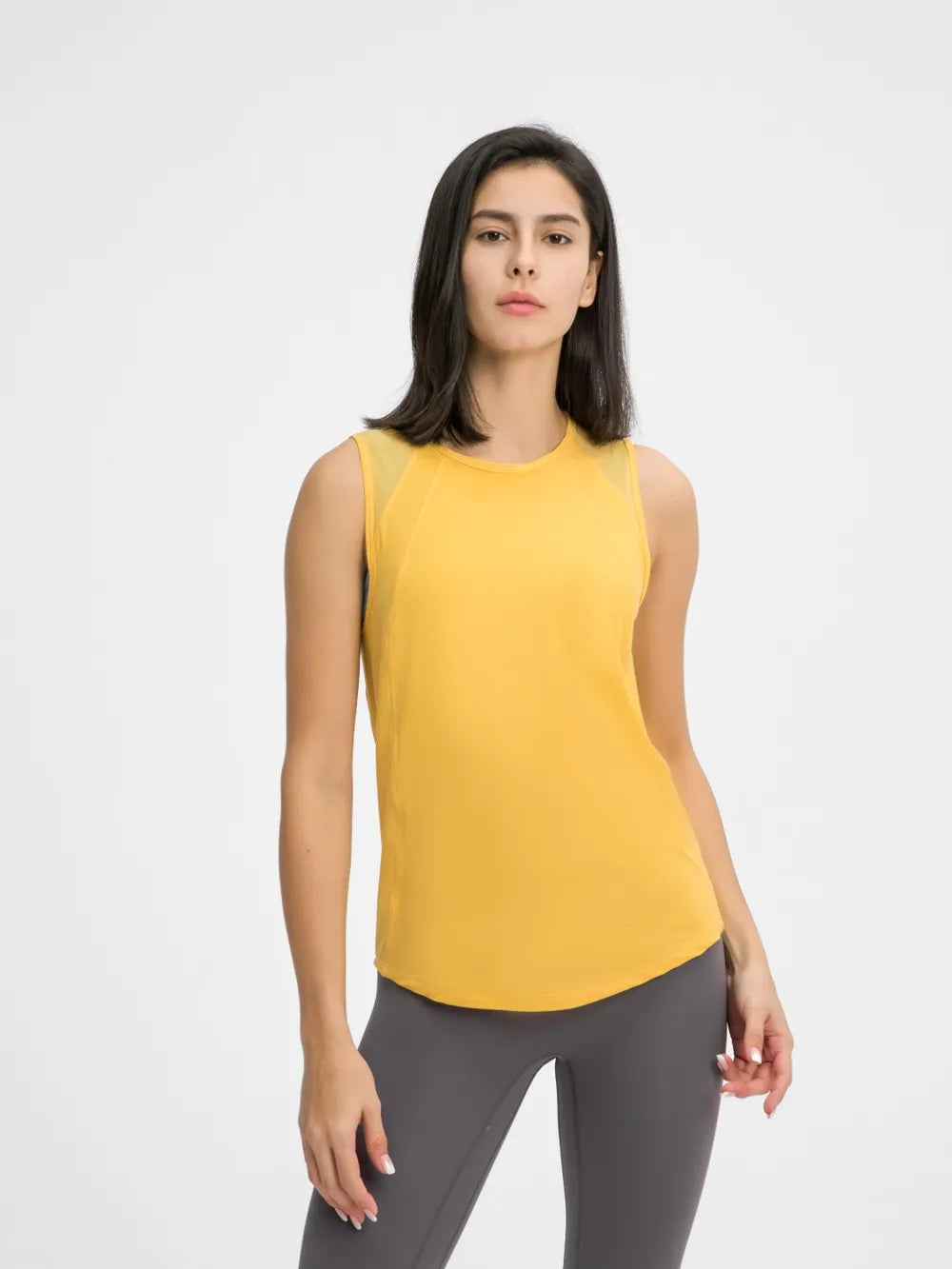 Yellow active tank top with round neck and sleeveless fit