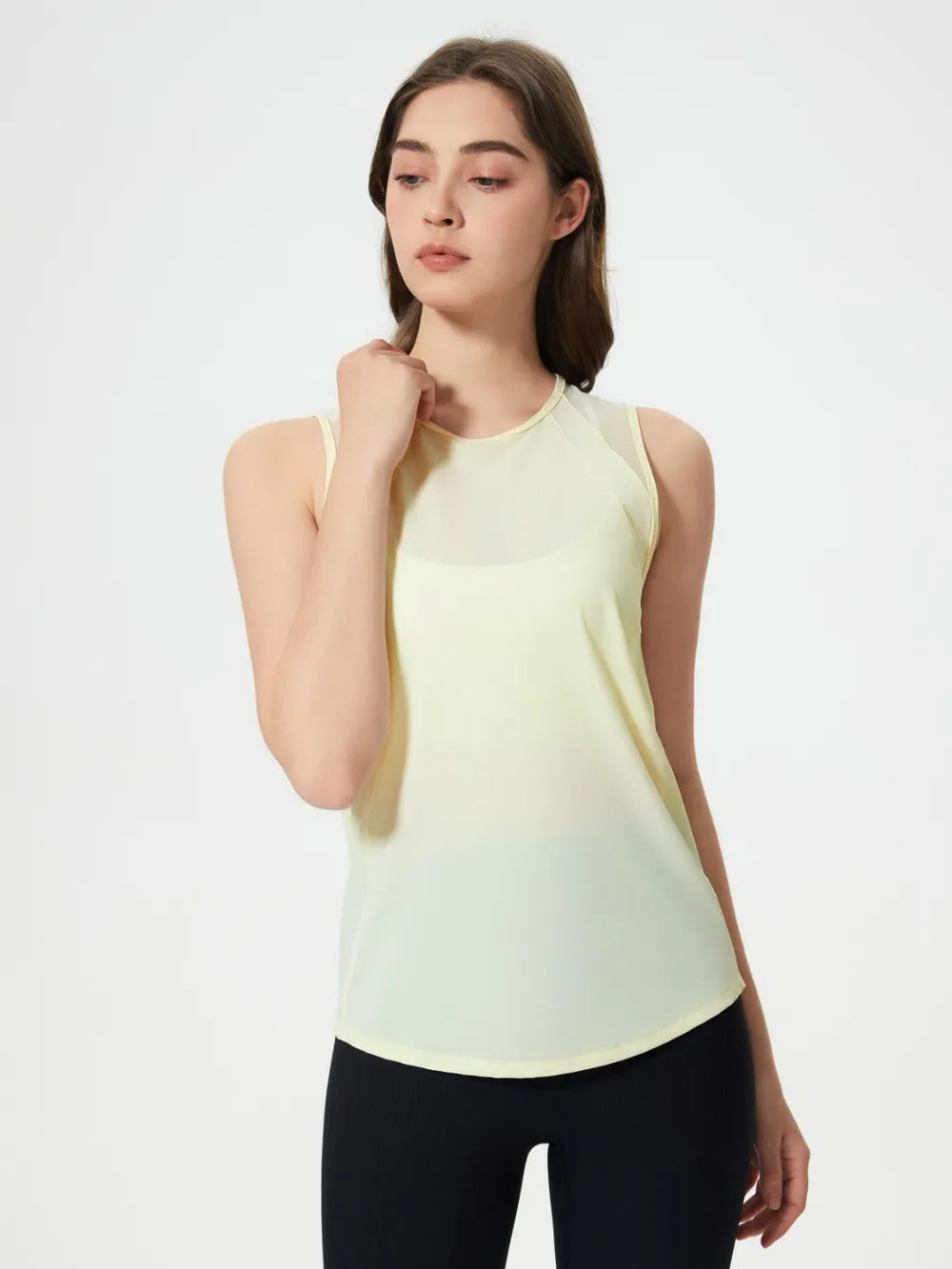 Pale yellow sleeveless active tank top with round neckline
