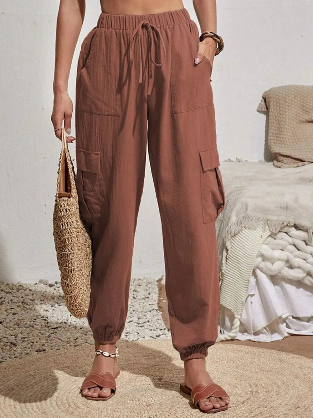 Dusty rose drawstring cargo joggers with side cargo pockets and elastic cuffs