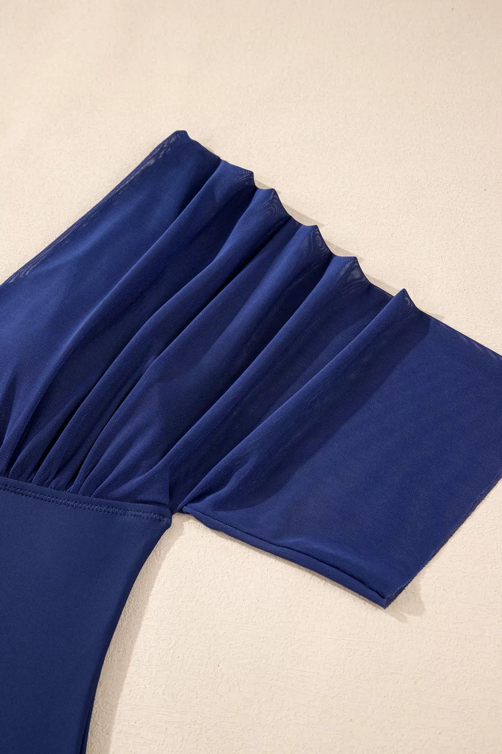 Navy pleated half-sleeve swimsuit with gathered sleeve panel