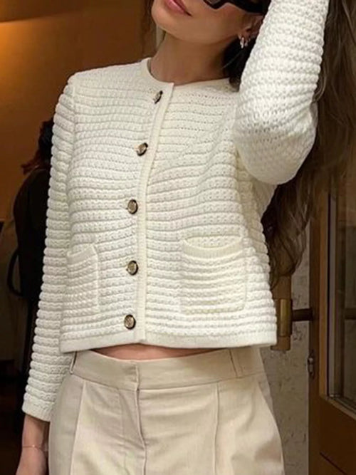 Cream long sleeve cardigan sweater with button placket and ribbed knit texture
