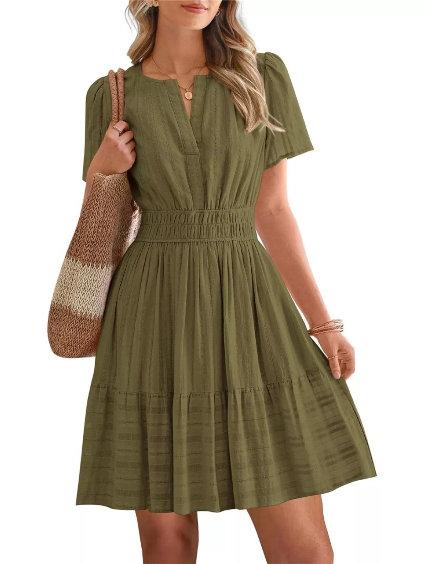 Olive green short-sleeve smocked-waist tiered dress with V-neck and tiered skirt.