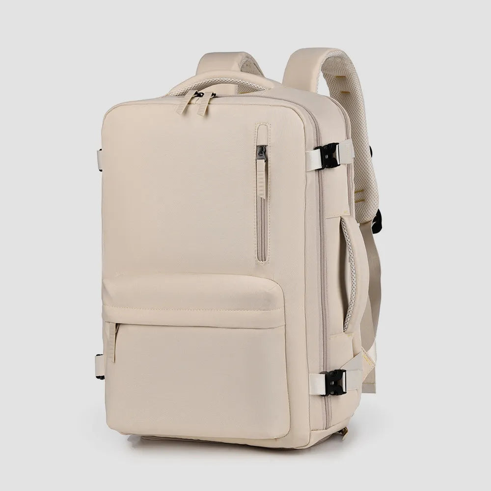 Beige oxford backpack with front zipper, side pockets, padded handle and shoulder straps