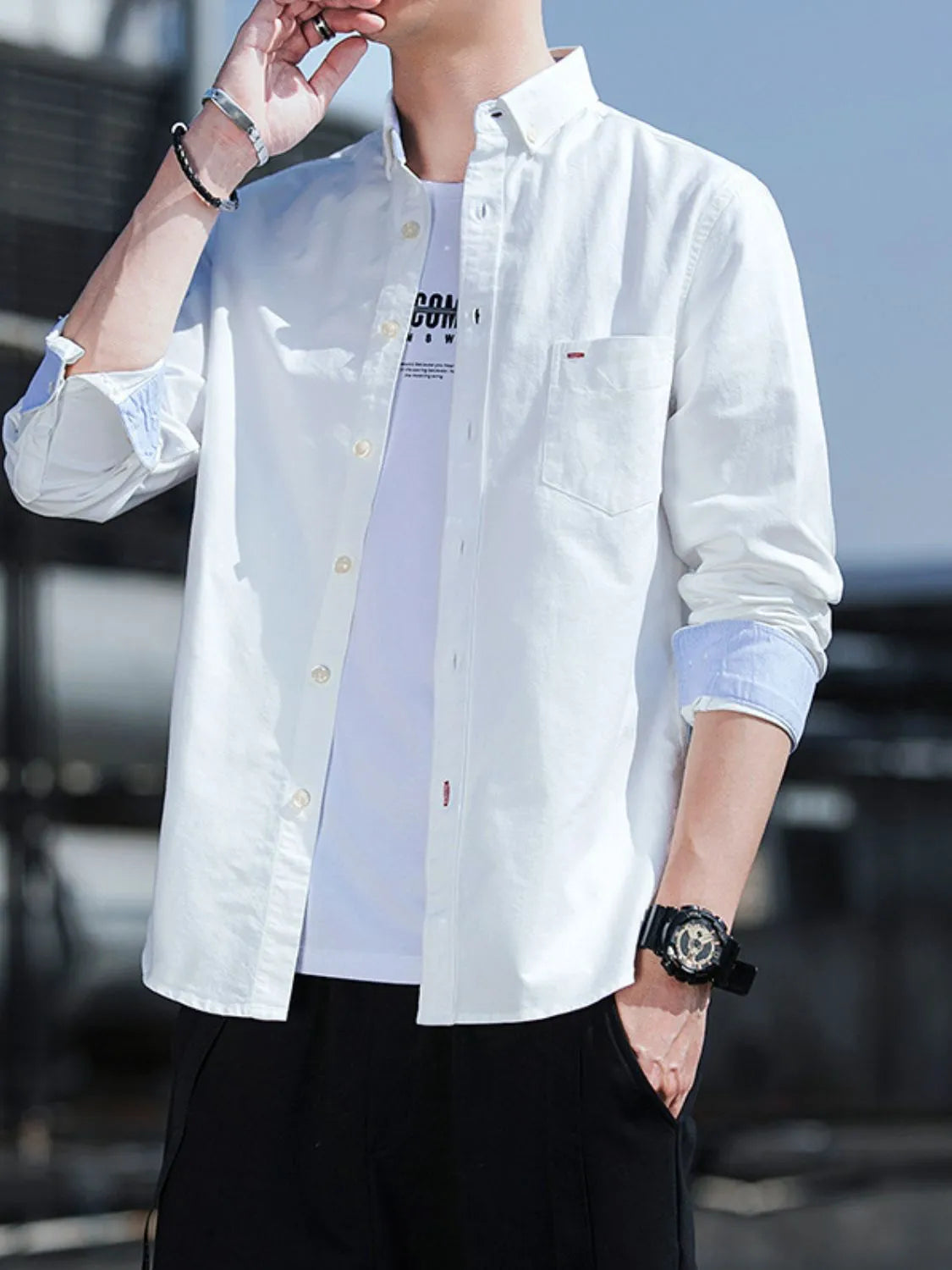 White button-down casual shirt with chest pocket and long sleeves