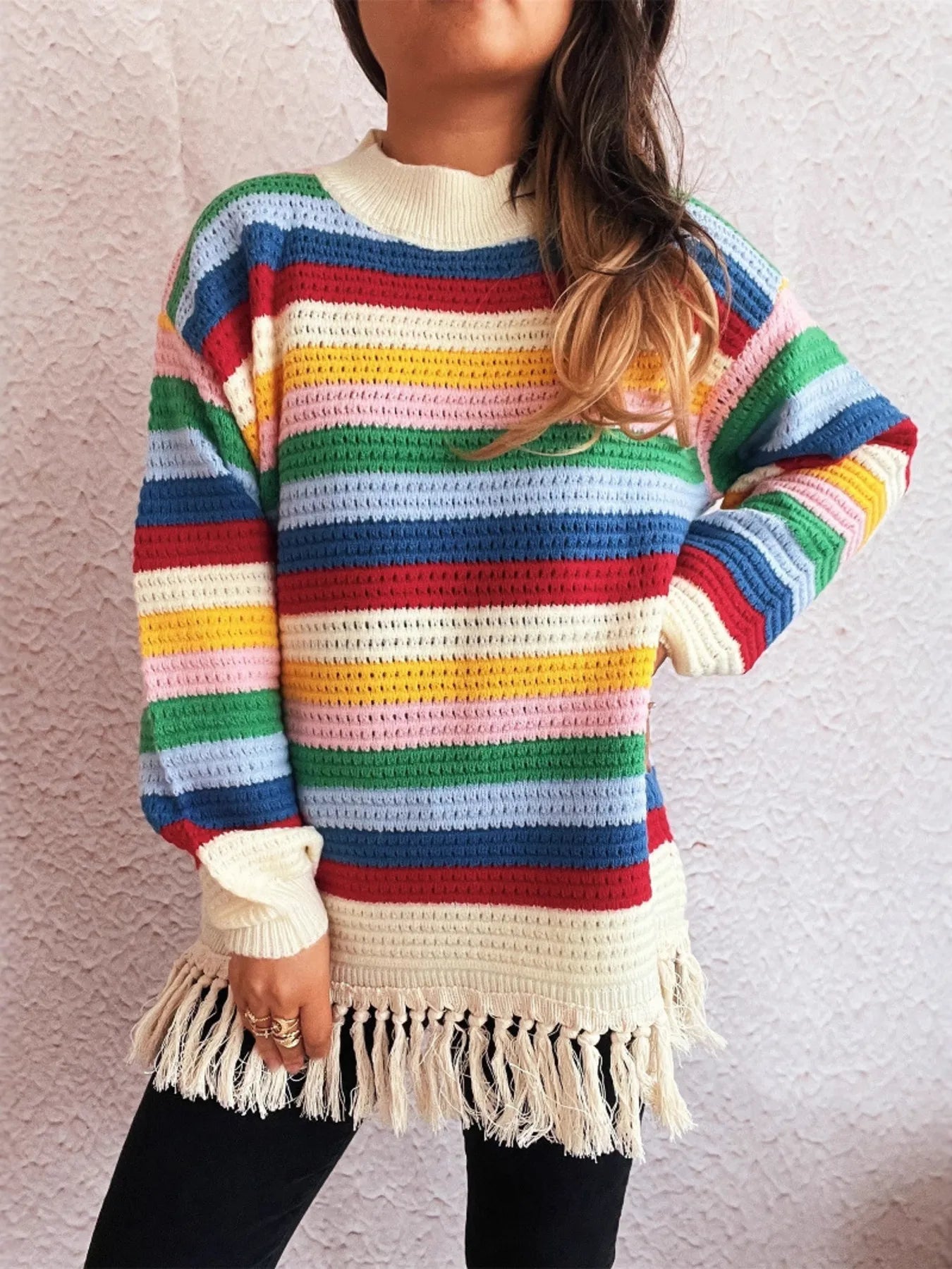 Rainbow striped long sleeve sweater with cream knit yoke and tassel fringe
