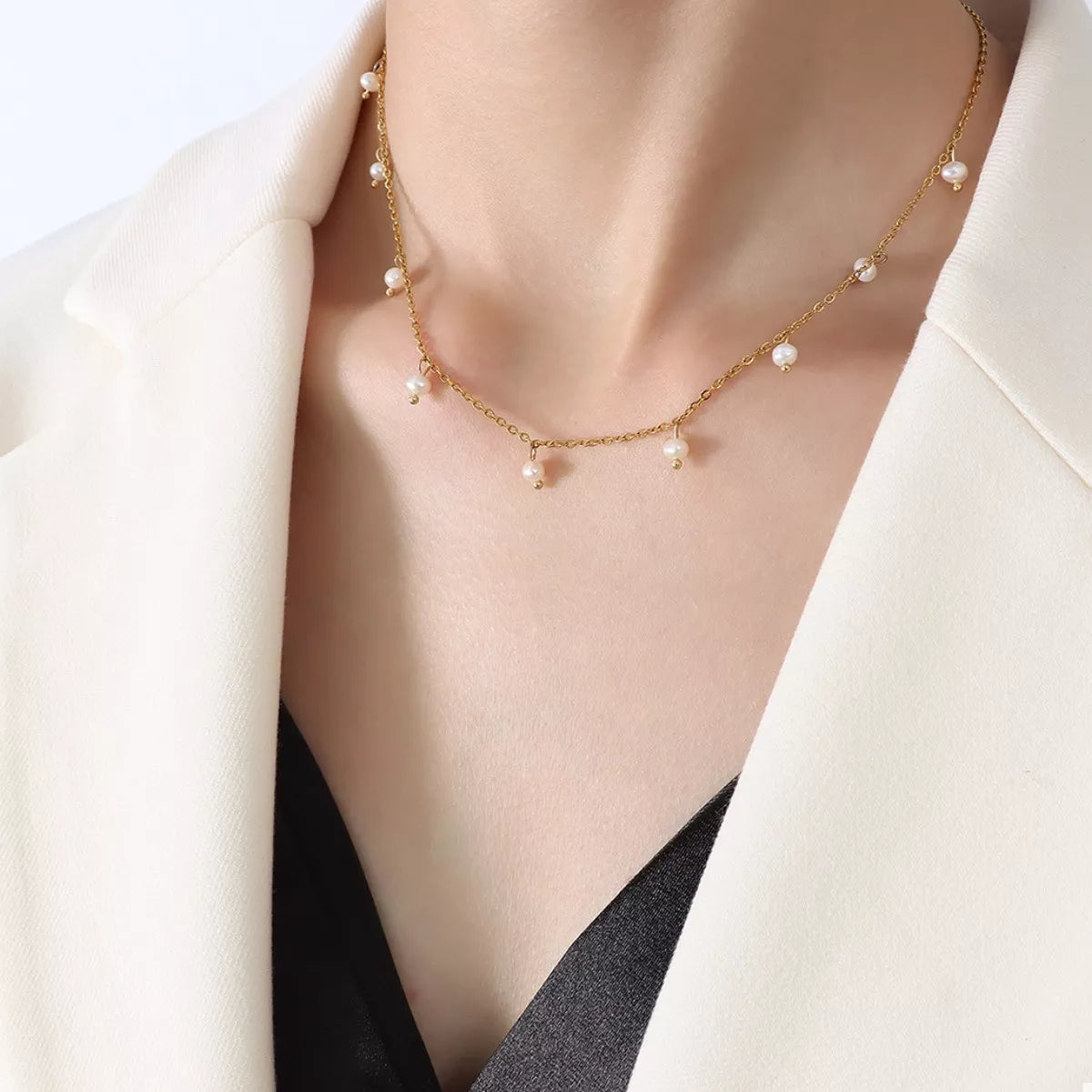 Gold-plated freshwater pearl necklace with evenly spaced pearls along the chain
