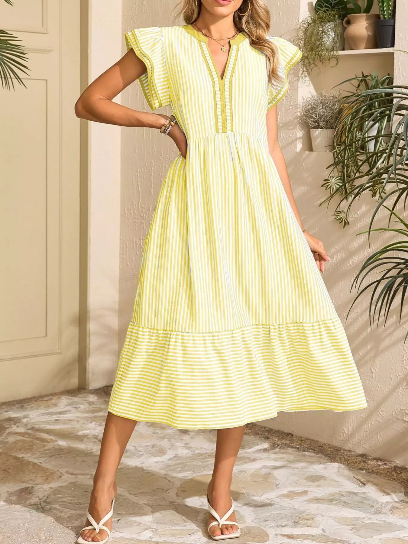 Striped yellow and white notched-ruffle sleeve dress with pockets, midi length