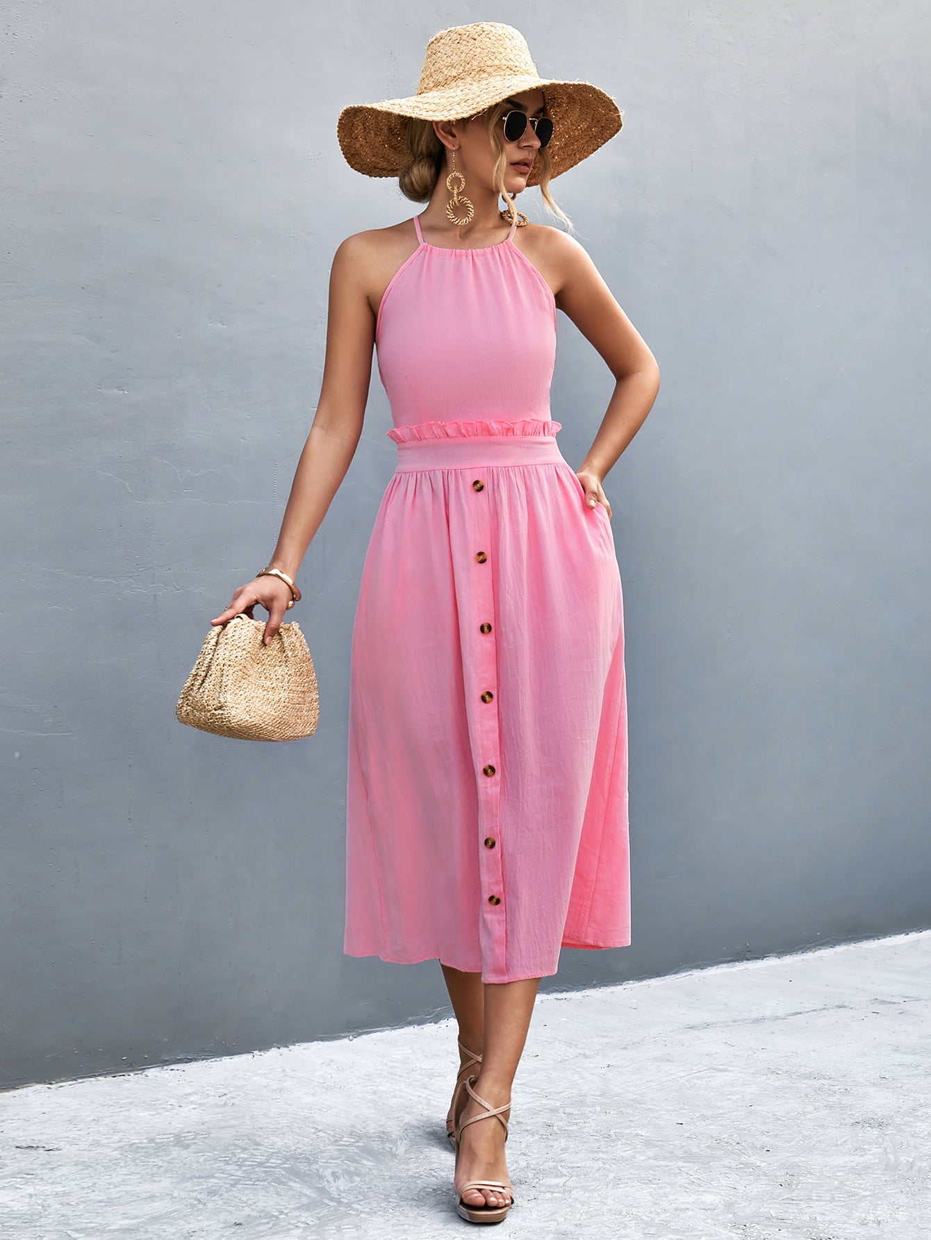 Pink button-front halter neck midi dress with frill neckline and midi length.