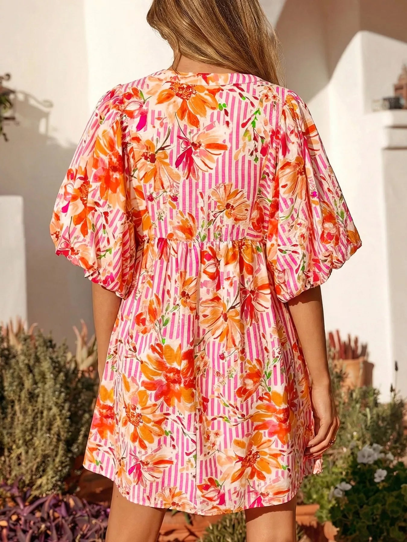 Cedar & Moore Floral print striped casual mini dress, pink stripes with orange flowers, back view