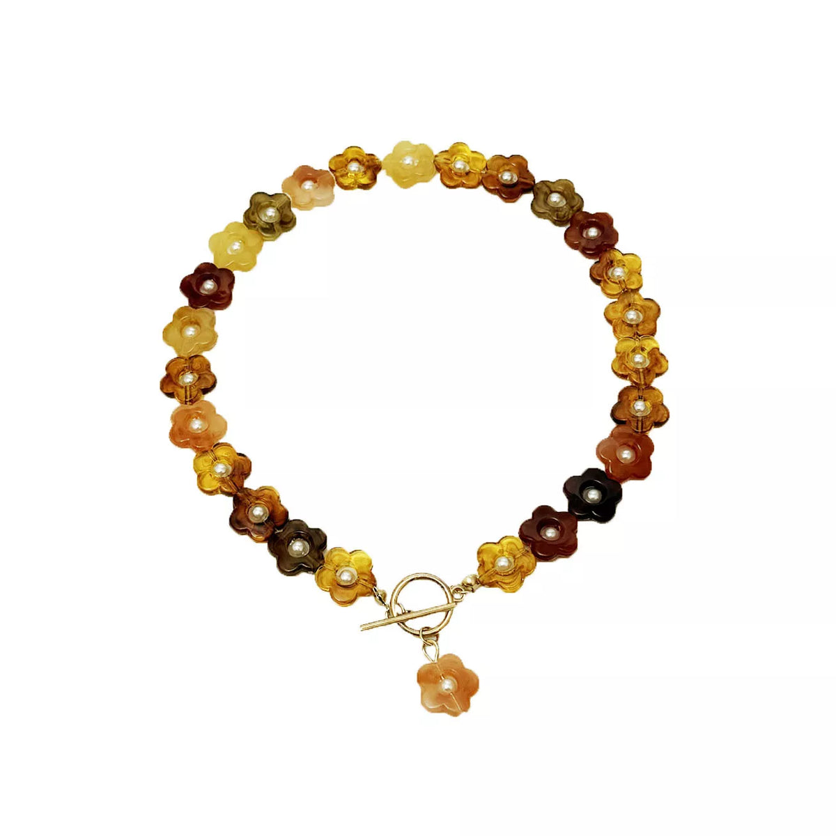 Flat-lay view of gold beaded necklace with amber and dark brown resin flower charms