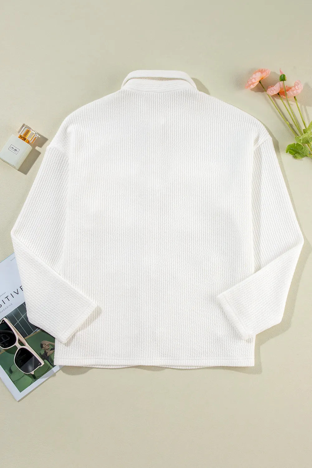 White long-sleeve shacket back view with stand collar and yoke seam.