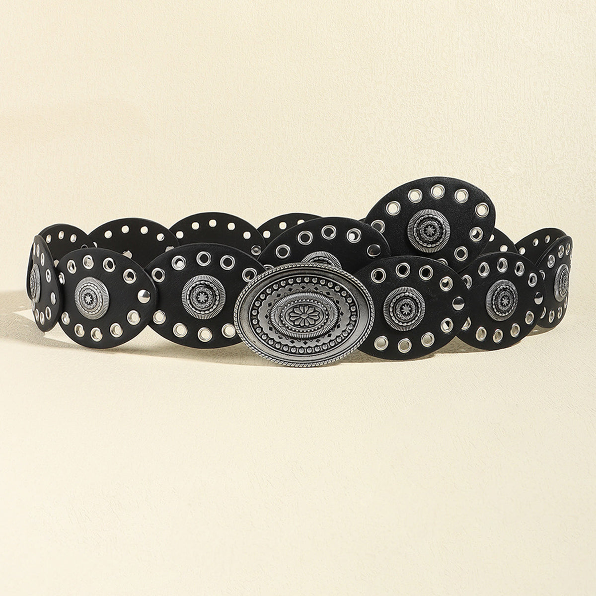 Black vegan leather belt with silver oval buckle and white circular stud detailing