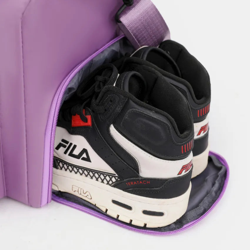 Large travel duffle bag interior pocket showing sneakers and storage compartment.