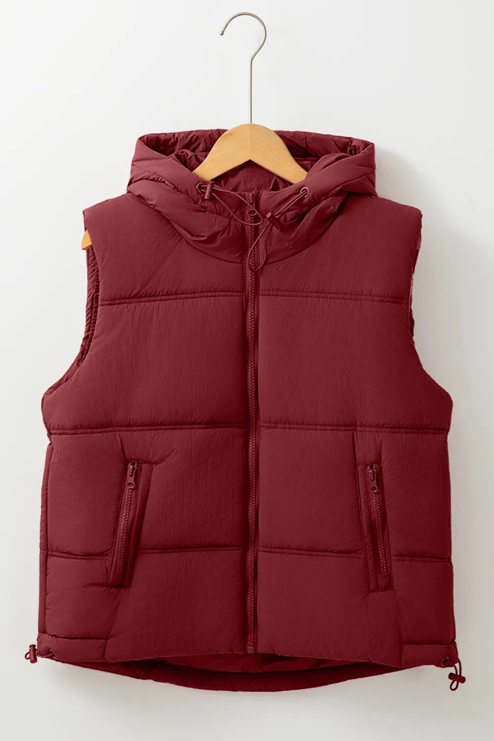 Burgundy hooded zip-up puffer vest coat on hanger with pockets and drawcord hem