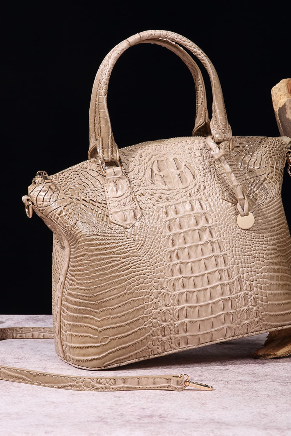 Croc-embossed vegan leather handbag in light beige with top handles and front emblem