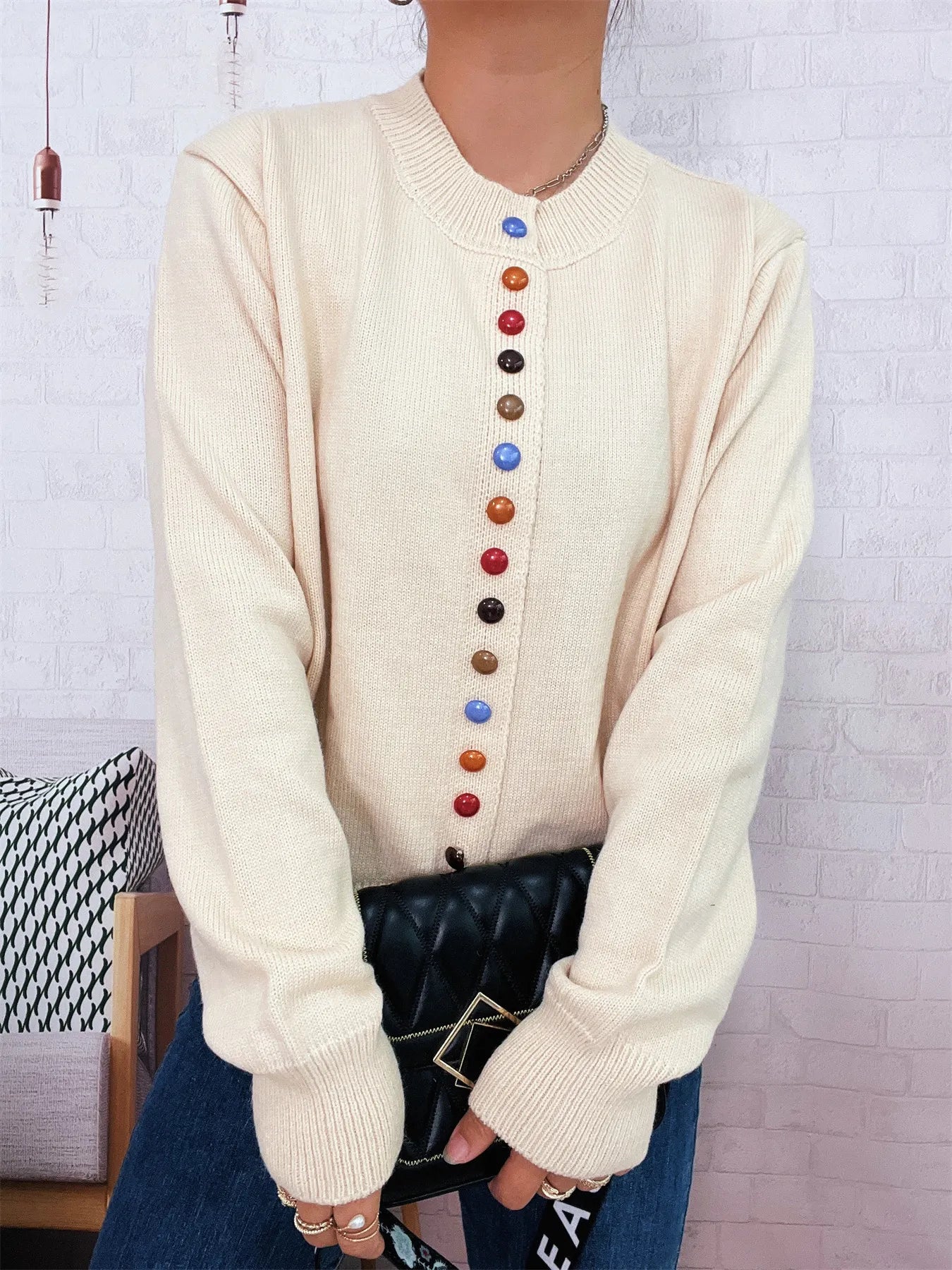 Cream knit cardigan with crew neck and multicolor buttons down the front