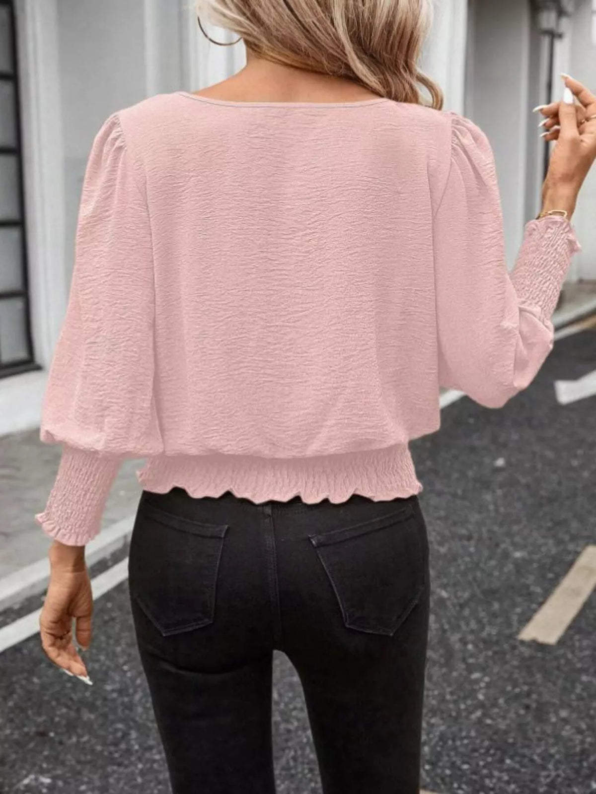 Pink smocked blouse with puff sleeves