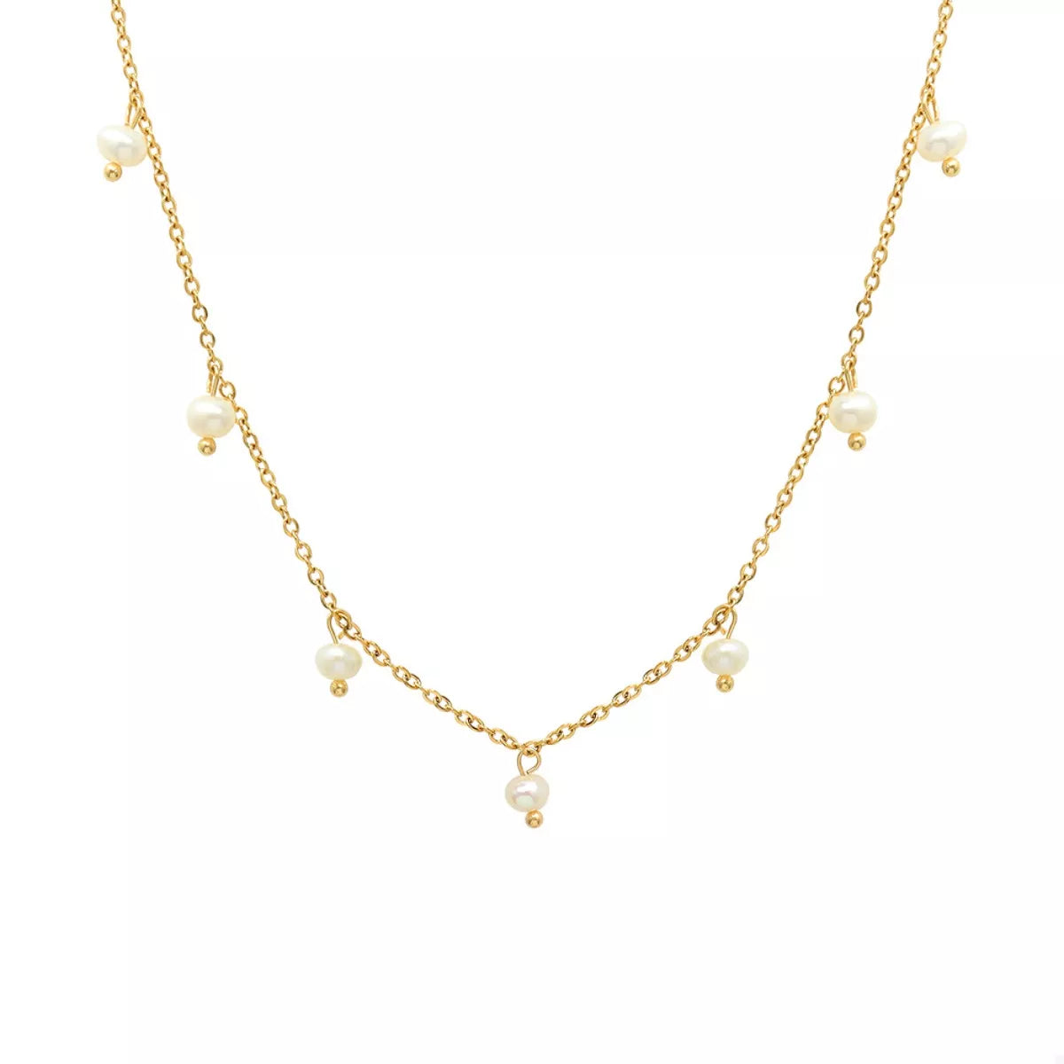 Gold-plated freshwater pearl necklace with small pearls spaced down the center