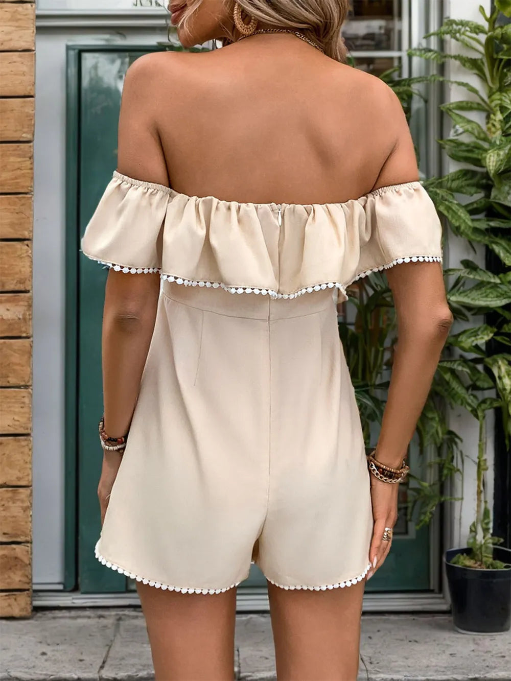 Light beige off-shoulder romper, ruffled neckline with scalloped trim, short back view