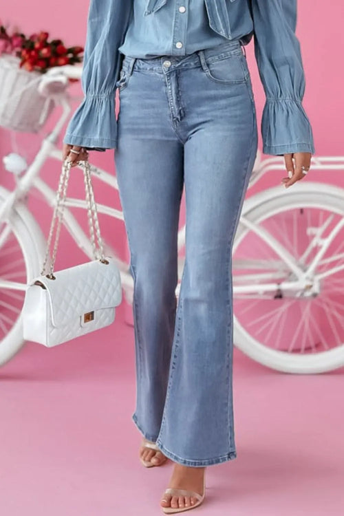 Light blue bootcut jeans with front pockets, belt loops, and flared hems