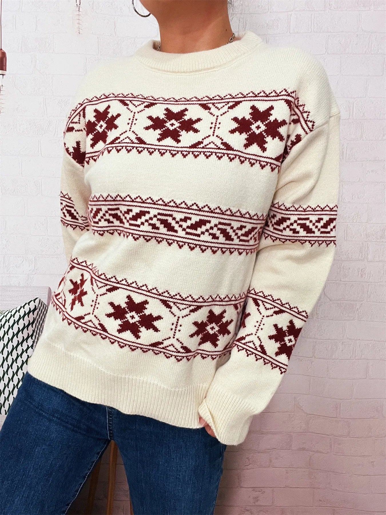White crewneck sweater featuring red snowflake Fair Isle yoke and banded cuffs