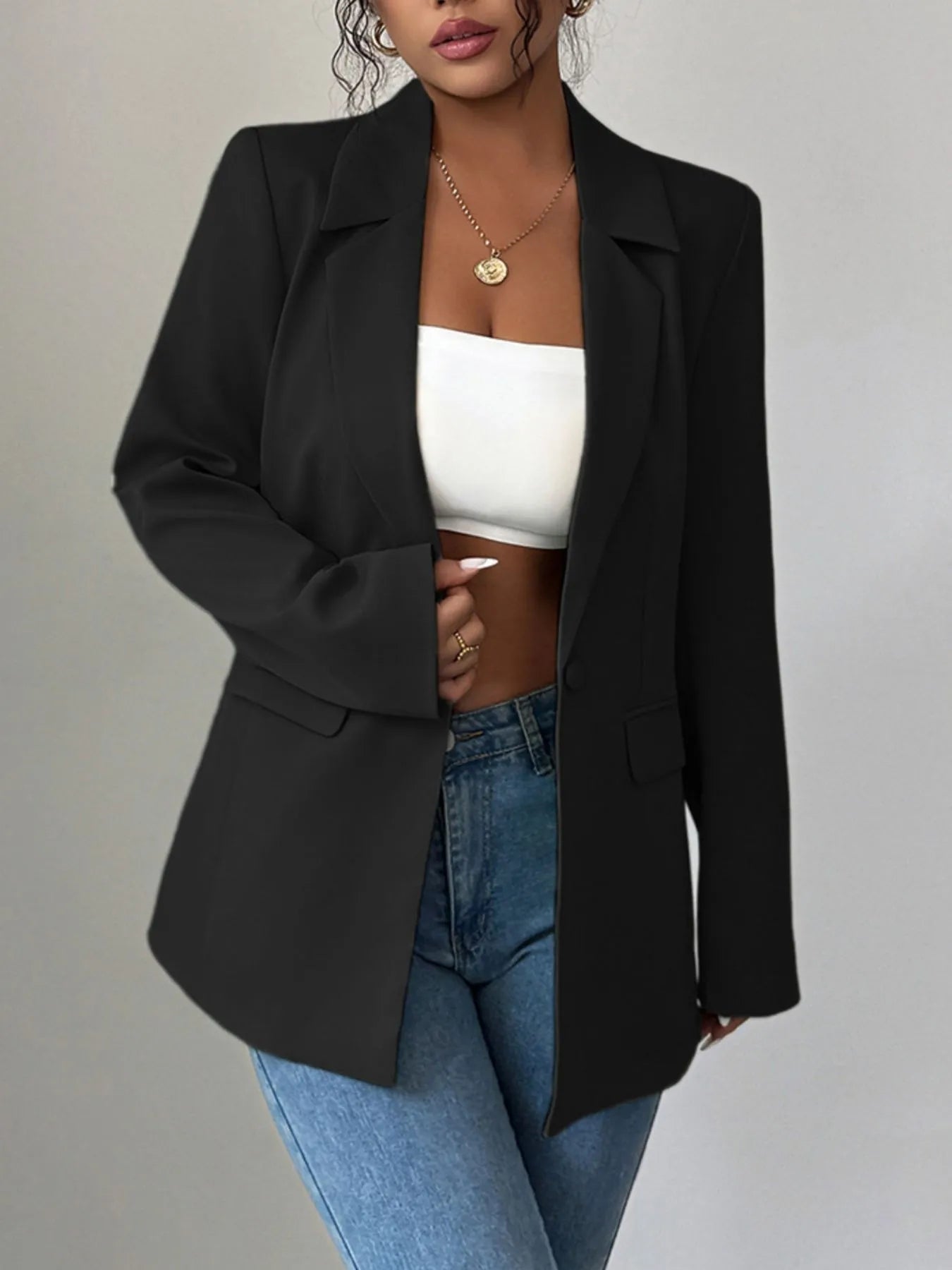 Black one-button lapel blazer with notch collar and flap pockets