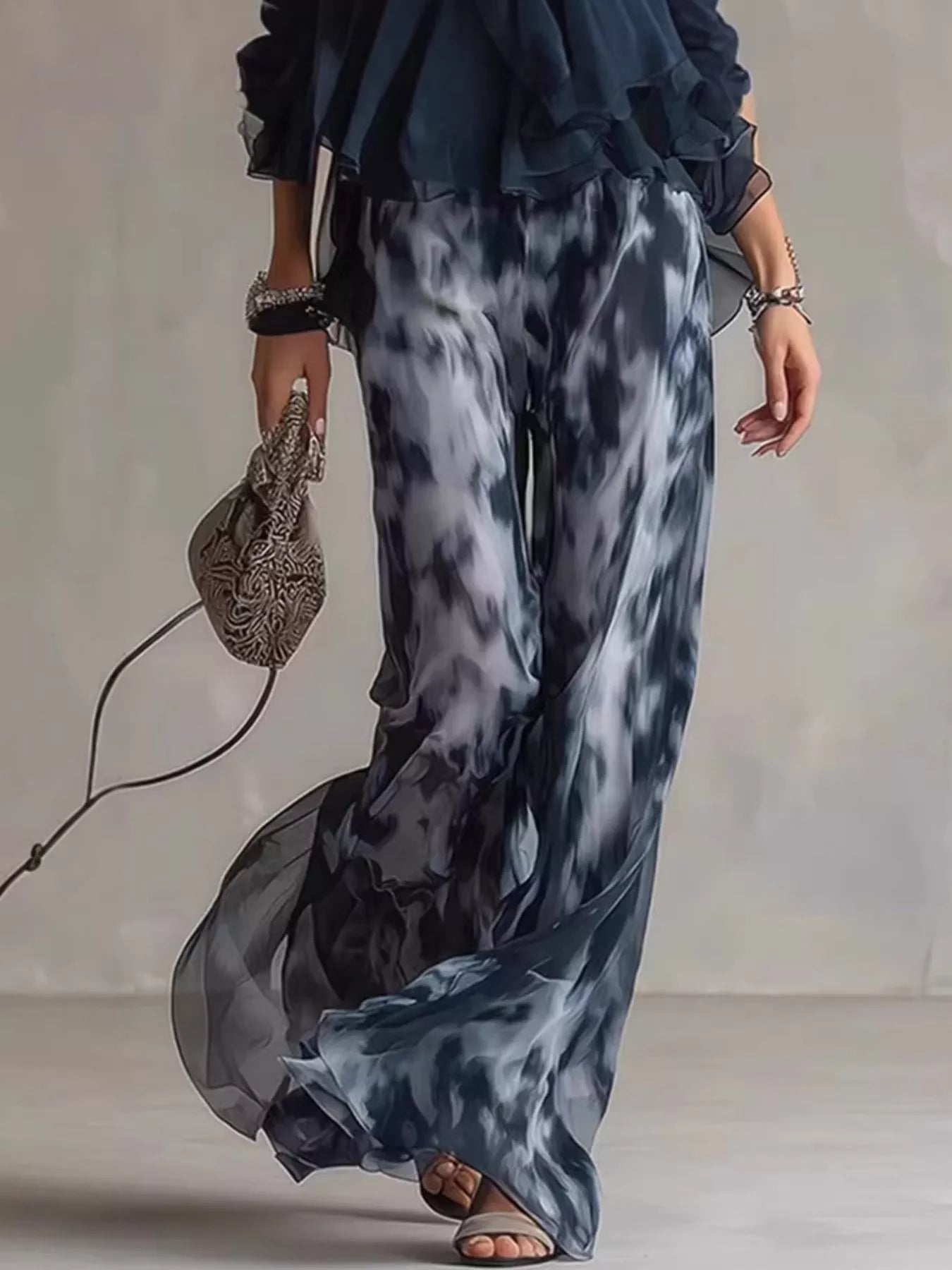 Dark blue halter ruffle top with tie-dye wide-leg pants, flowy set.