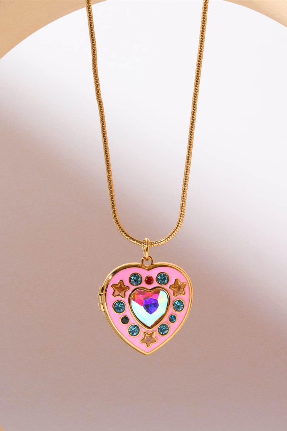 Heart box pendant necklace with gold chain and pink enamel heart charm with rhinestones