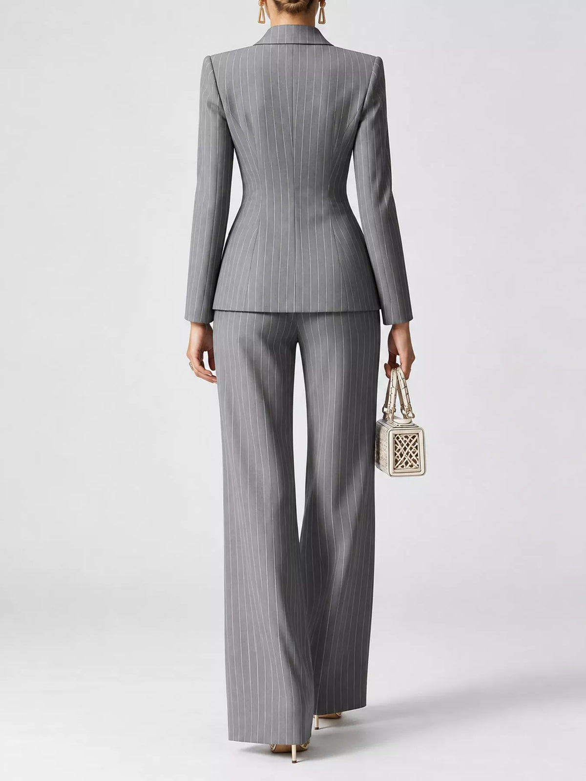 Back view of gray pinstripe blazer and wide-leg pants set, fitted waist seam