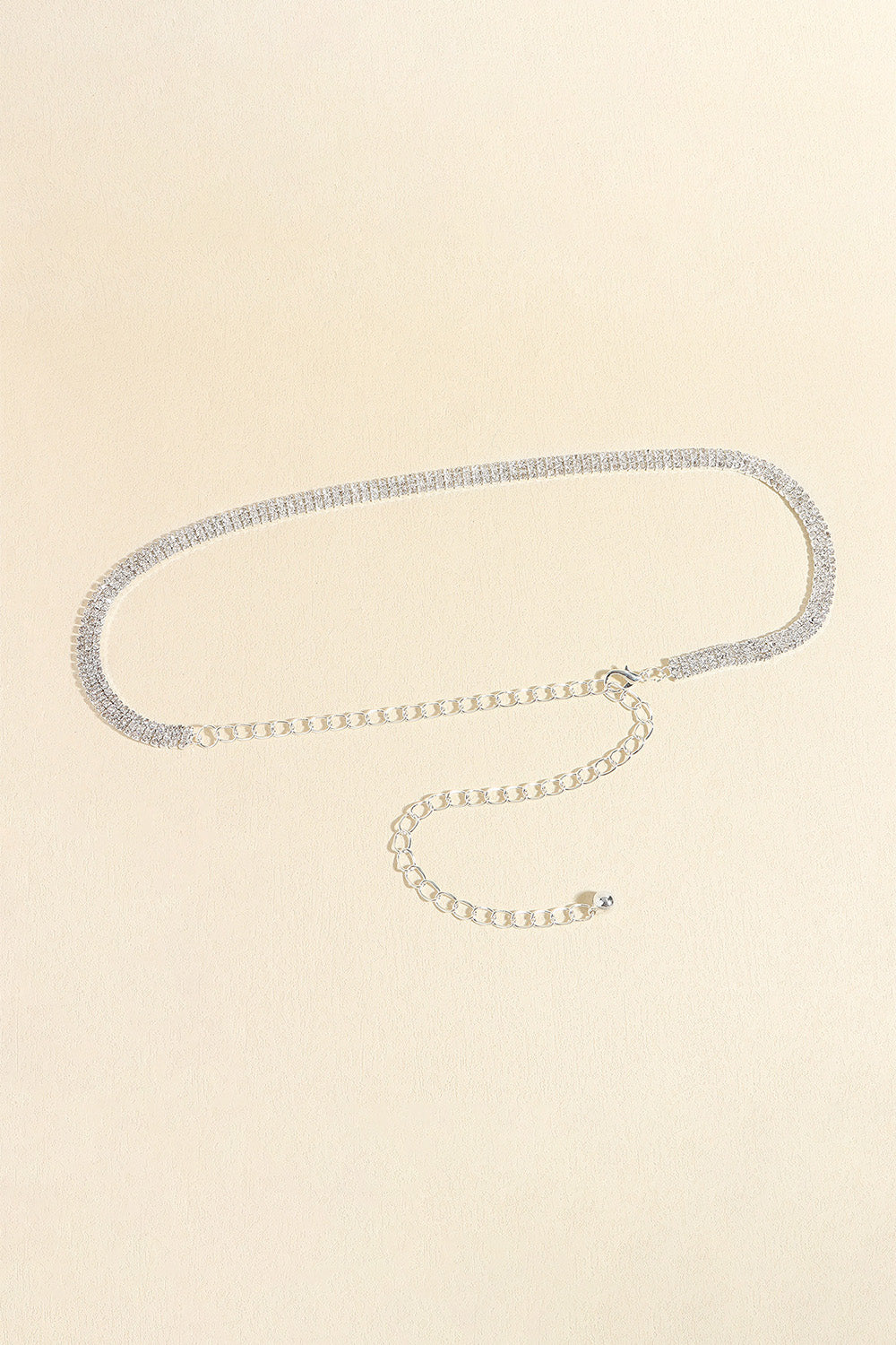 Silver-toned rhinestone alloy belt with adjustable chain and clasp