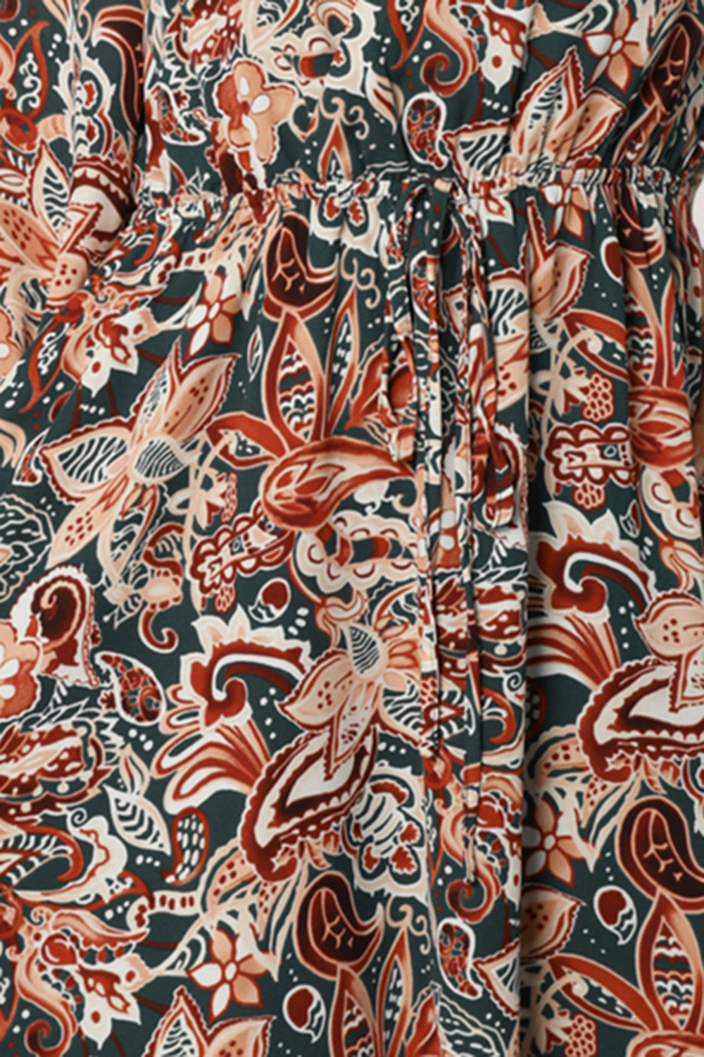 Long-sleeve V-neck mini dress fabric close-up, paisley multicolor print with drawstring