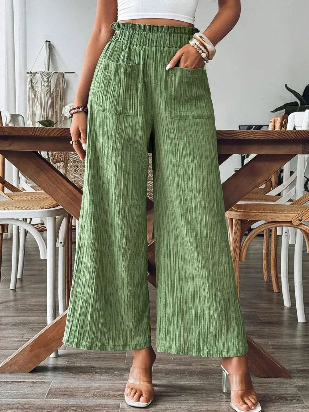 Frill wide-leg pants in green with elastic waistband, side pockets, wide straight legs