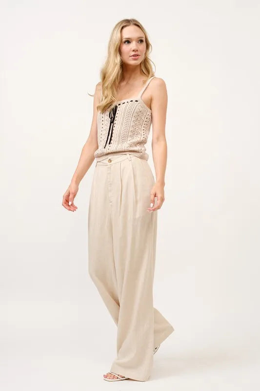 High-rise wide-leg linen-blend pants in oatmeal, side view of loose fit