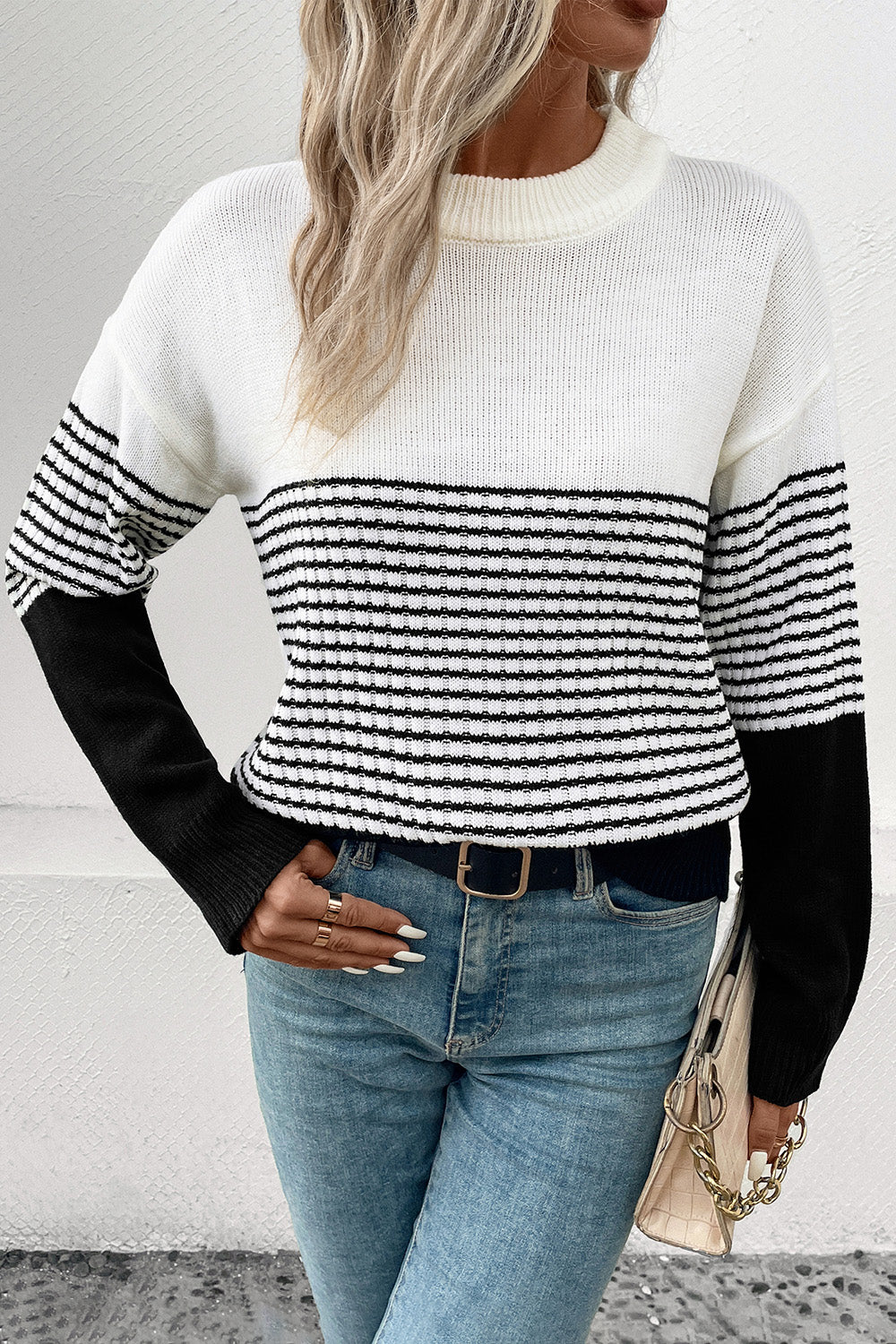 Striped drop-shoulder sweater, white with black horizontal bands across the chest, ribbed cuffs