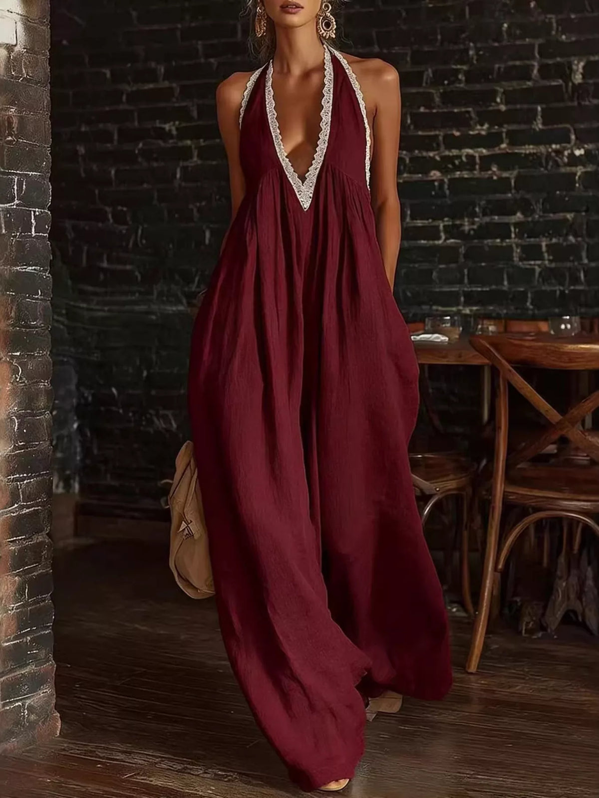 Wine red halter neck lace-trim wide-leg jumpsuit with deep V neckline and airy drape
