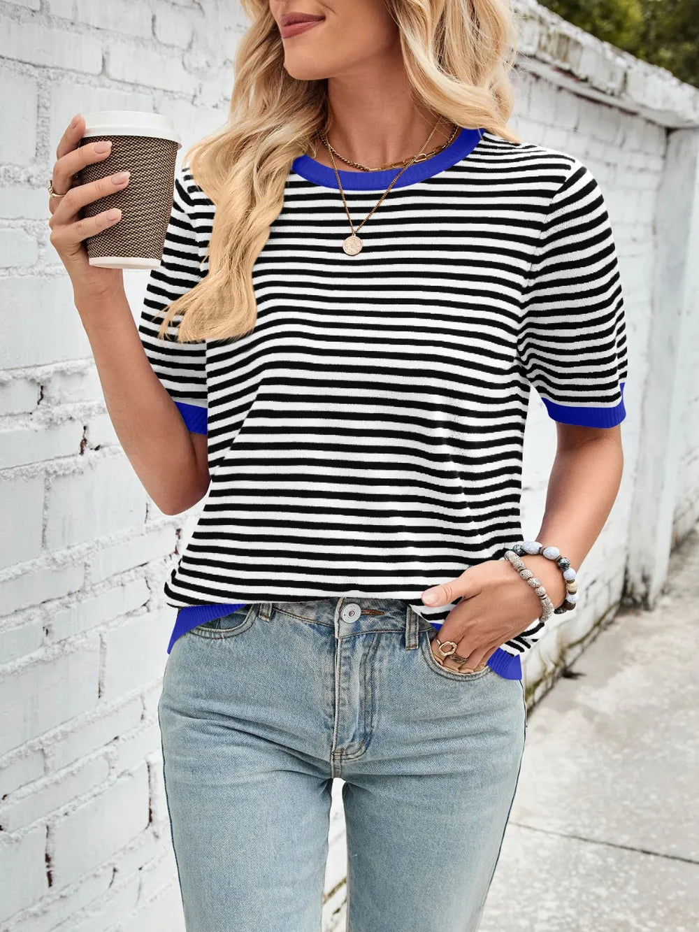 Striped knit top, black-and-white horizontal stripes with blue ribbed crew neck and cuffs