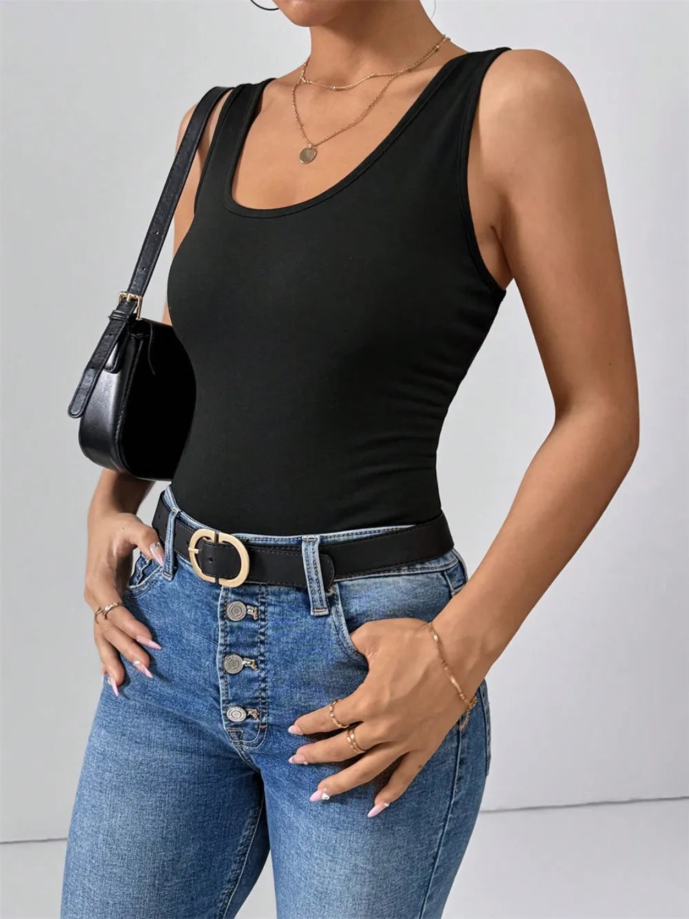 Black scoop neck wide-strap tank top with smooth fitted silhouette