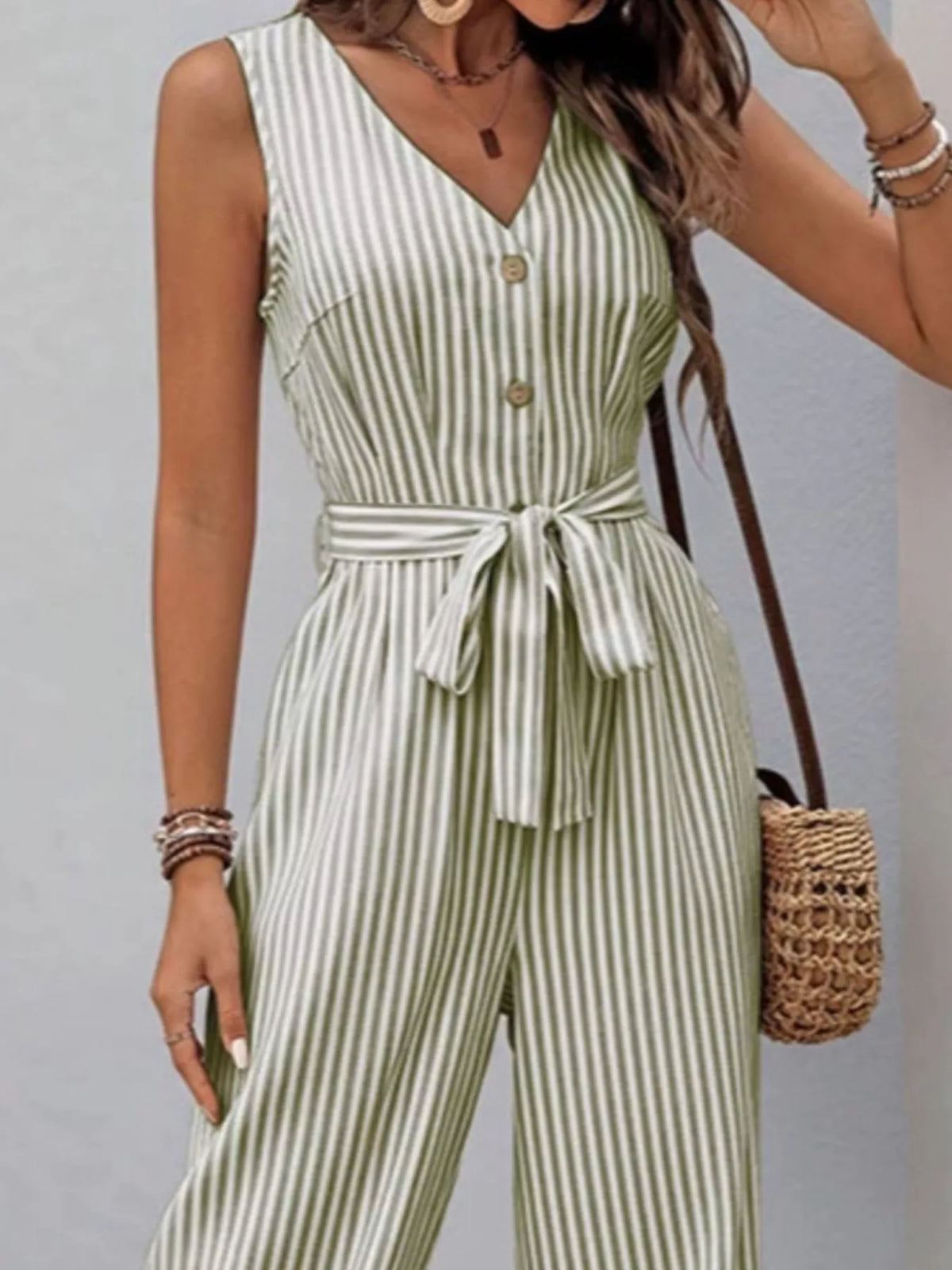 Striped sleeveless V-neck belted jumpsuit in army green and white, tie waist detail