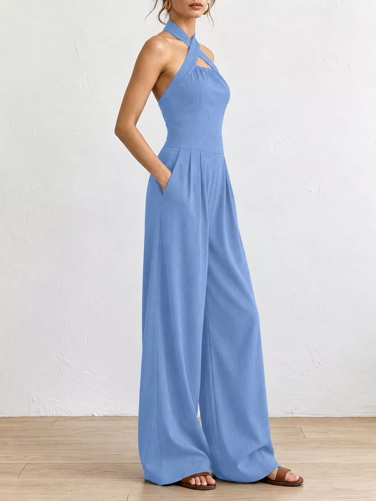 Light blue halter jumpsuit, gathered waist seam, flared wide-leg trousers