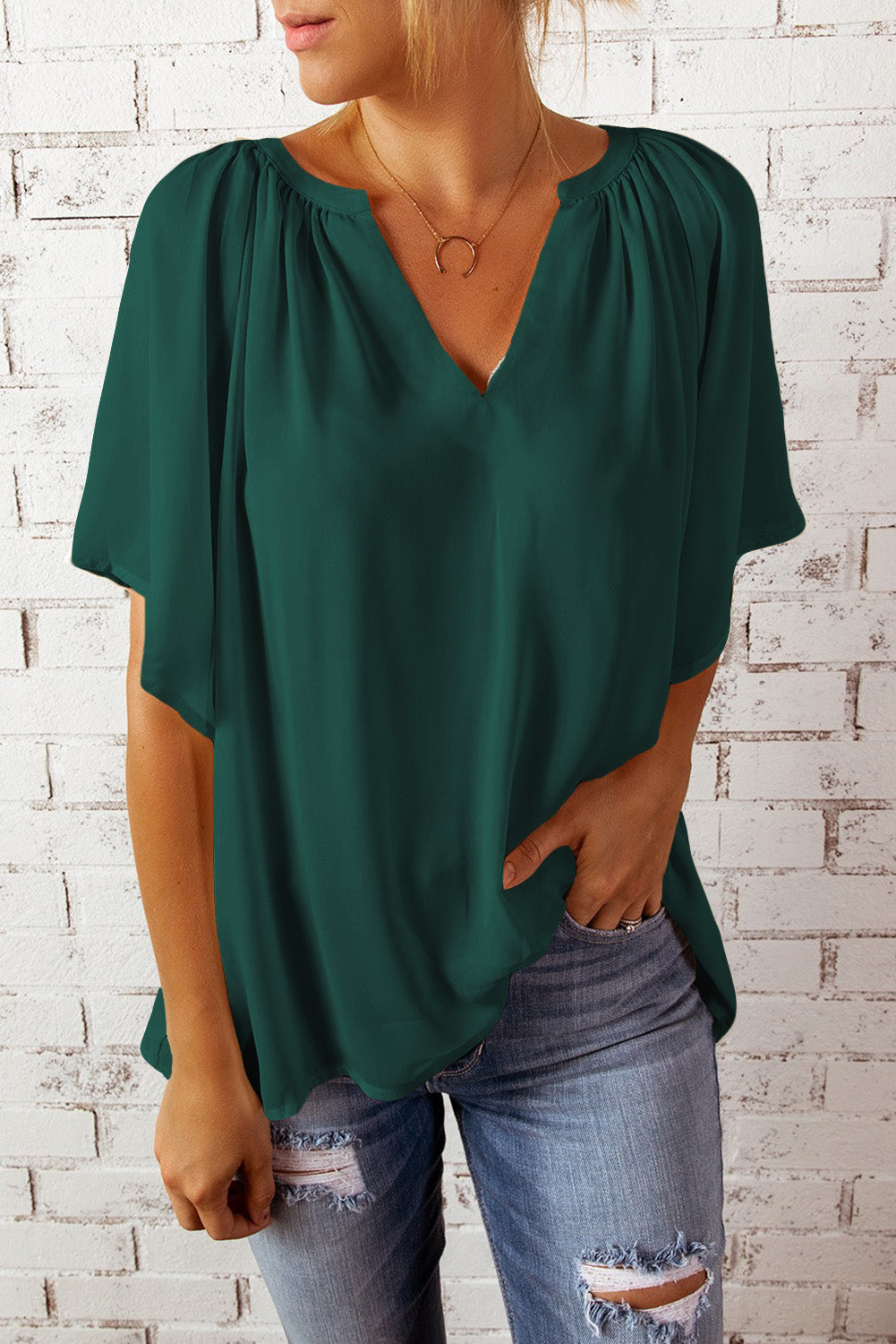 Deep green gathered flutter sleeve blouse with notched neckline